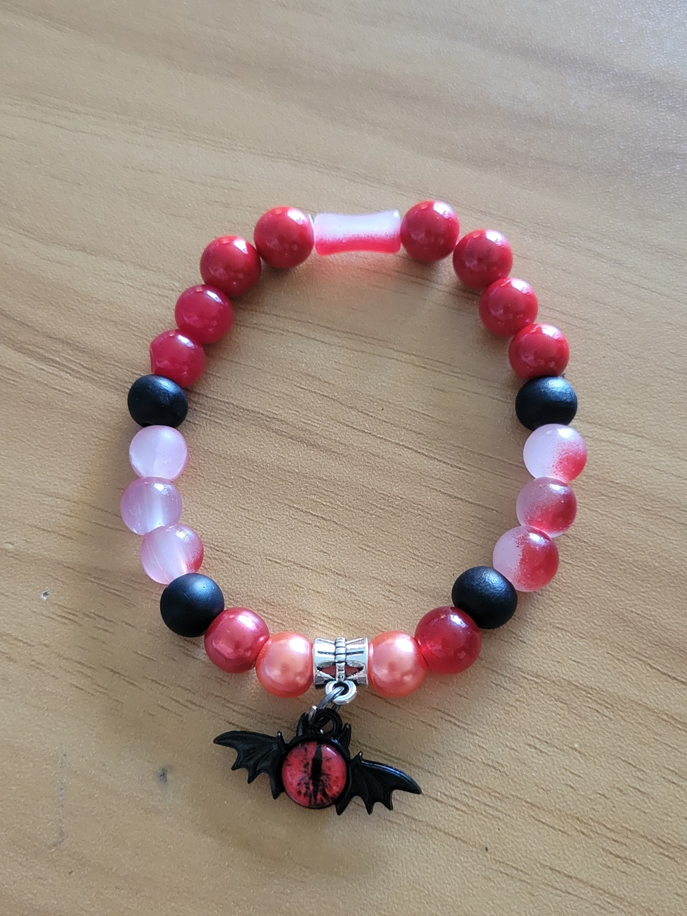 🍁NEW🍁Hand Crafted Red and Pink Beaded Bracelet with Bat Charm